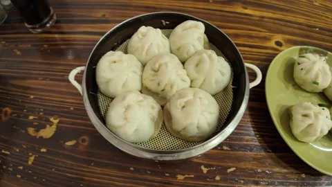 Fresh Steamed Buns Served on Plates at Shanghai Breakfast Shop 스톡 동영상 340176857