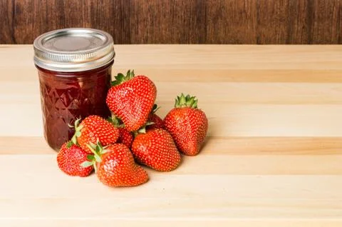 Fresh strawberries and strawberry jam Stock Photos