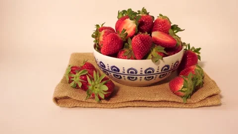 Fresh Strawberries in a Decorative Bowl on Burlap Fabric Stock-Footage 301012553