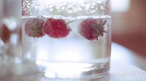 Fresh strawberries is falling down to the water in slow motion Stock Footage 64314970
