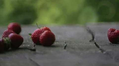 Fresh strawberries falling on the table. Stock Footage 64275859