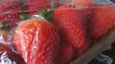 Fresh strawberries inside plastic packaging Stock Footage 341904905
