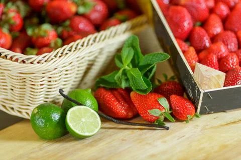 Fresh Strawberries with Lime Mint and Vanilla on Wooden Table for Dessert I.. Stock Photos