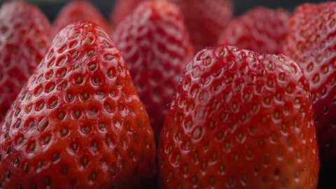 Fresh strawberries macro view on dark background 動画素材 105178854