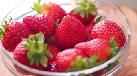 Fresh strawberries rotating with sunlight. Stock Footage 61798728