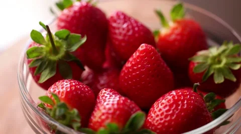 Fresh strawberries rotating with sunlight. Stock Footage 61799138