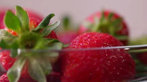 Fresh strawberries rotating with sunlight. Stock Footage 61799445
