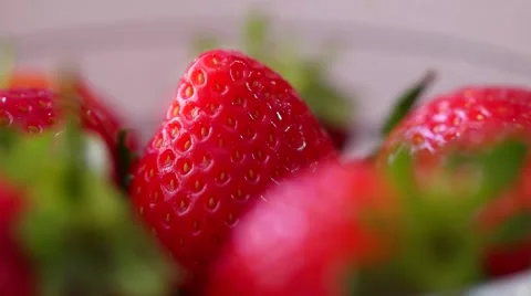 Fresh strawberries rotating with sunlight. Video stock 61799583