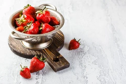 Fresh strawberries in a while colander Stock Photos