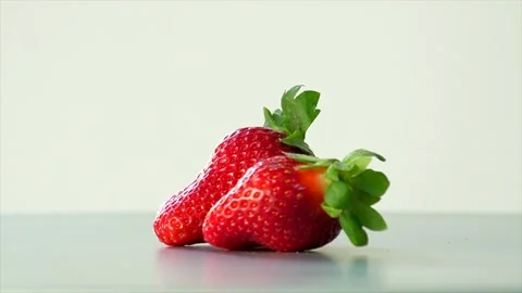 Fresh Strawberry Close-Up Rotating Hand Made Stock Footage 233910924