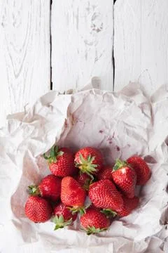 Fresh strawberry in paper wrapper Foto stock