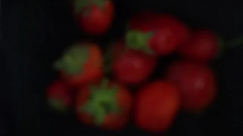 Fresh strawberry's falling on black background Stock Footage 83497079