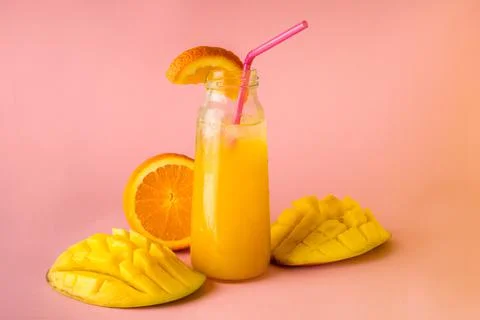 Fresh summer cold mango cocktail with orange. High quality photo Stock Photos