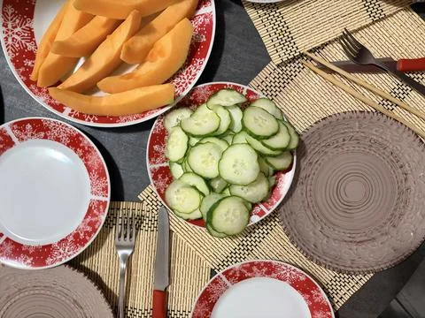 Fresh Summer Table with Sliced Cucumbers and Melon Stock-Fotos