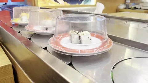 Fresh sushi on covered plates 스톡 동영상 345557784
