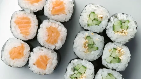 Fresh Sushi roll set rotating. Typical Japanese food, dish consisting of rice Stock Footage 125360371