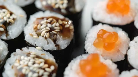 Fresh Sushi roll set rotating. Typical Japanese food, dish consisting of rice Stock Footage 125361486