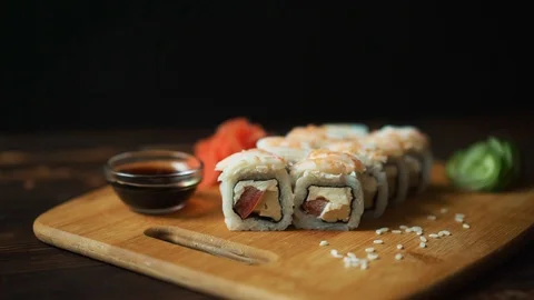Fresh sushi, rolls on the table. Dark background. Sushi sticks. Stock Footage 92126011