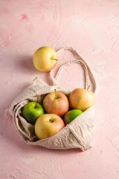 Fresh sweet apples in reusable textile grocery bag Stock Photos