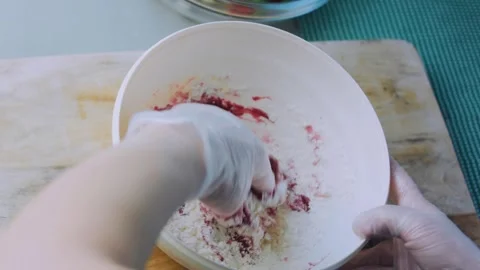 Fresh tabletop moment: kneading beet dough by hand Stock Footage 342173459