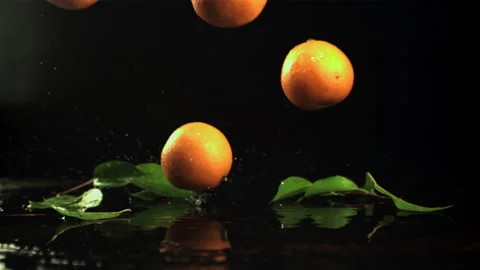 Fresh tangerines fall on the table. Filmed is slow motion 1000 frames per second Video stock 167091692