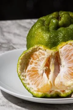 Fresh tangerines on the table. Selective focus. Stock Photos