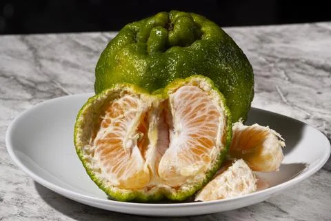 Fresh tangerines on the table. Selective focus. Stock Photos