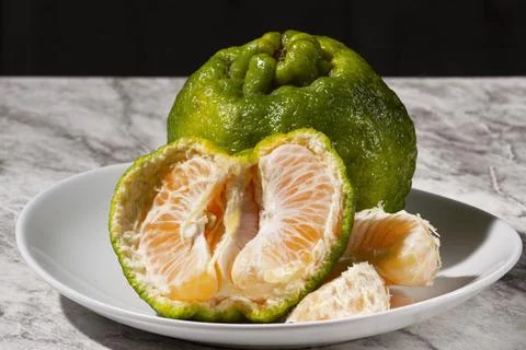 Fresh tangerines on the table. Selective focus. Stock Photos