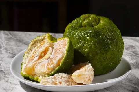Fresh tangerines on the table. Selective focus. Stock Photos