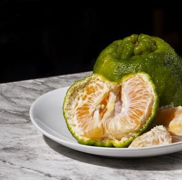 Fresh tangerines on the table. Selective focus. Stock Photos