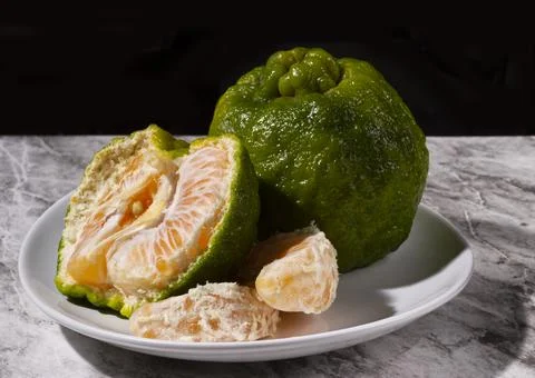 Fresh tangerines on the table. Selective focus. Stock Photos