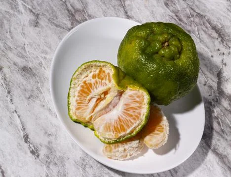Fresh tangerines on the table. Selective focus. Stock Photos