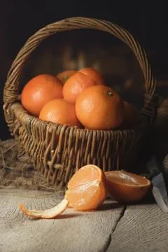 Fresh tangerines on a table in a warm kitchen Stock Photos