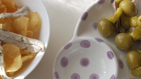 Fresh tapas featuring Gildas and Boquerones with olives and anchovies on skewers Stock Footage 301879280