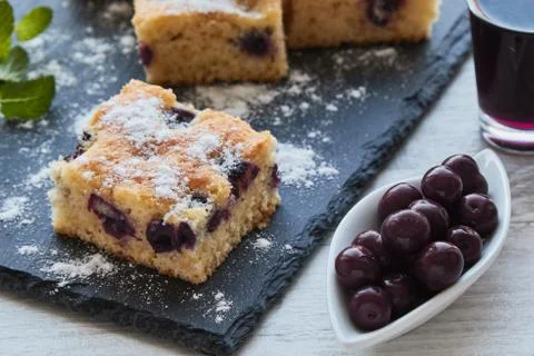Fresh tassty cherry fruit sponge cake with sugar Stock Photos