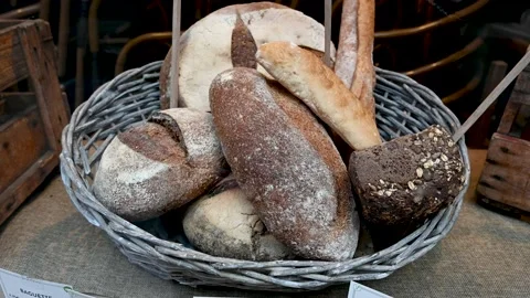 Fresh tasty breads in basket. Different tasty bread in bakery. Fresh loaves 動画素材 219436232