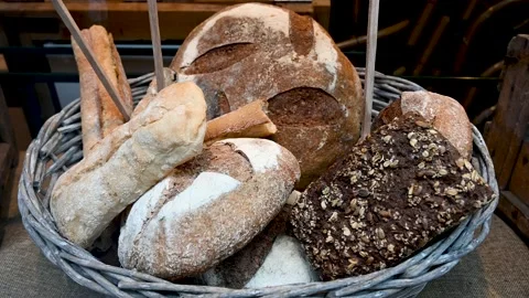 Fresh tasty breads in basket. Different tasty bread in bakery. Fresh loave 動画素材 219436488