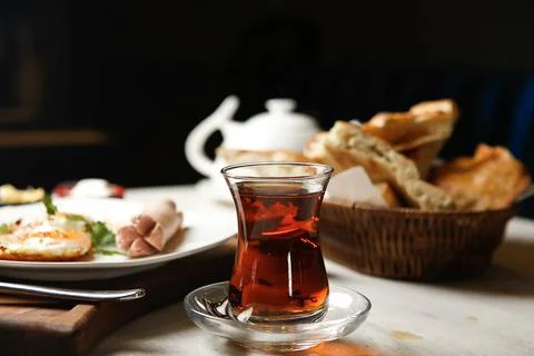 Fresh tea and bread served with breakfast in a cozy setting Stock Photos