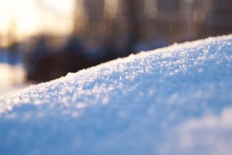 Fresh thick layer of snow close-up. Winter landscape with a blurry background Stock Photos