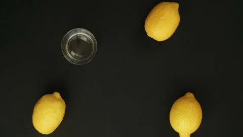 Fresh three lemon two oranges is Squeezed Into a Glass. Stop Motion Animation Stock Footage 87831149