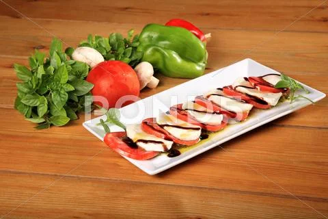 Fresh tomato and mozarela cheese Stock Photos