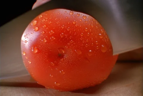 A fresh tomato being sliced, close-up Stock Footage 86883738