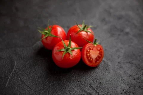 Fresh tomato on black background Stock Photos