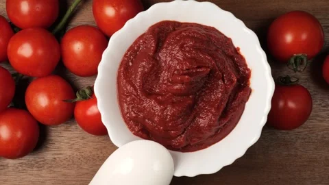 Fresh tomato paste in bowl with cherry tomatoes Stock Footage 344915552