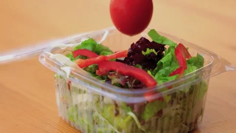 Fresh Tomato Placed into Plastic Salad Container Close-Up Stock Footage 339111314