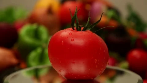 Fresh Tomato Rotating Among Assorted Vegetables Close-Up Stock Footage 343742588
