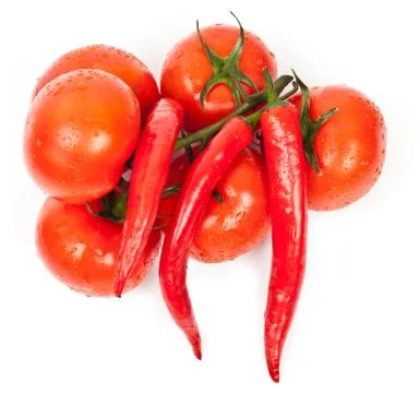 Fresh tomatoes and hot peppers Stock Photos