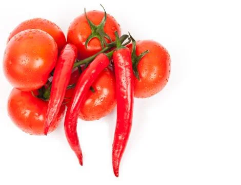 Fresh tomatoes and hot peppers Stock Photos