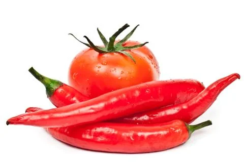 Fresh tomatoes and hot peppers Stock Photos
