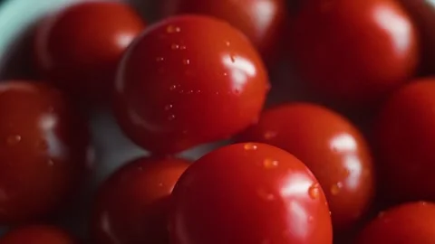 Fresh tomatoes are arranged on a surface, highlighting their vibrant red color Stock-Footage 338290208